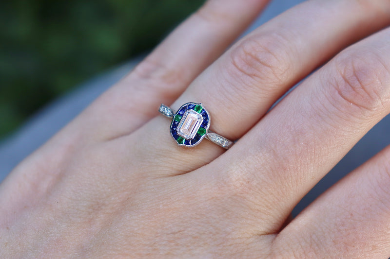 Platinum Emerald Cut Diamond with Sapphire and Emerald Art Deco Style Halo