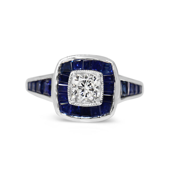 18ct White Gold Cushion Cut Diamond and Channel Set Sapphire Halo Ring