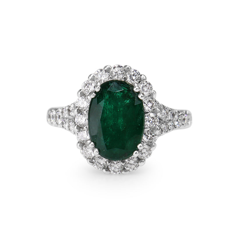 18ct White Gold Emerald and Diamond Halo Ring