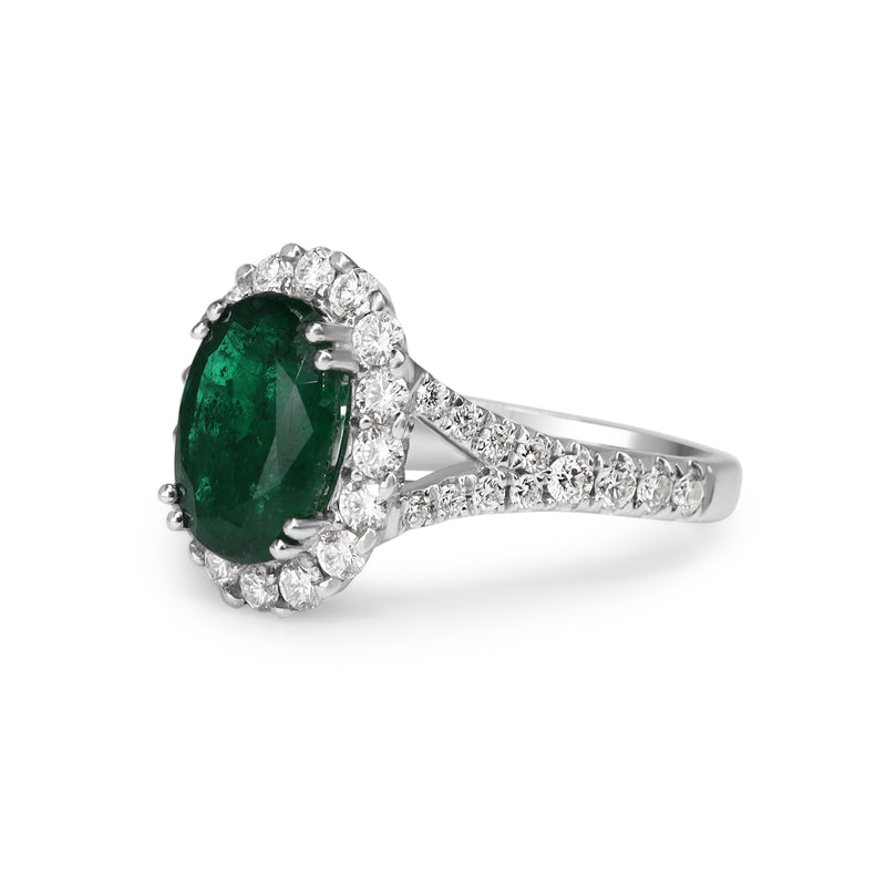 18ct White Gold Emerald and Diamond Halo Ring