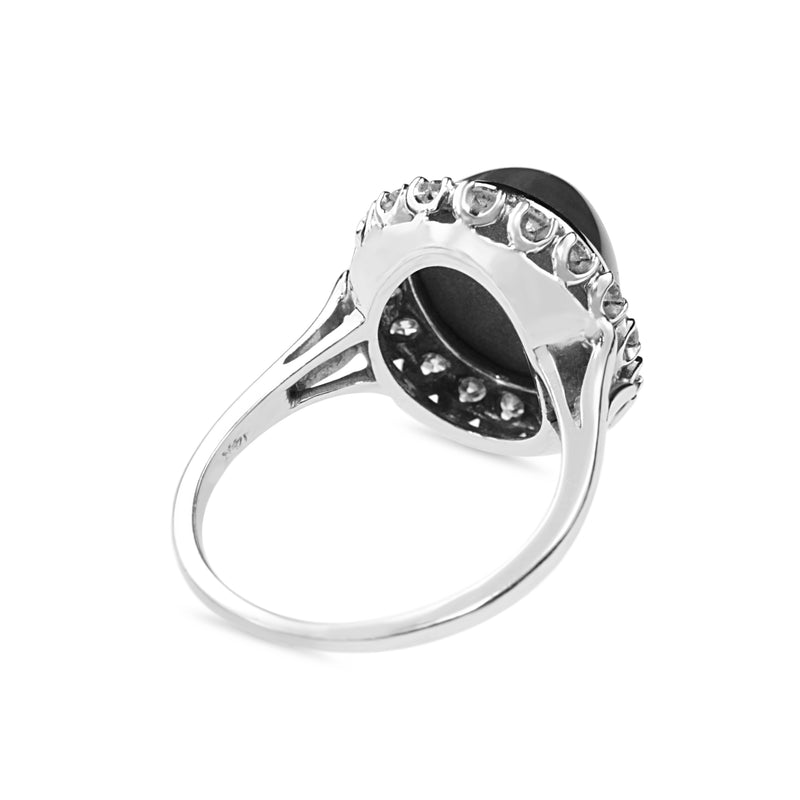 14ct White Gold Synthetic Star Sapphire and Diamond Halo Ring