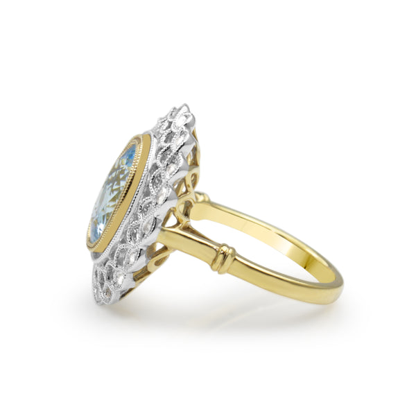 18ct Yellow and White Gold Aquamarine and Diamond Halo Ring