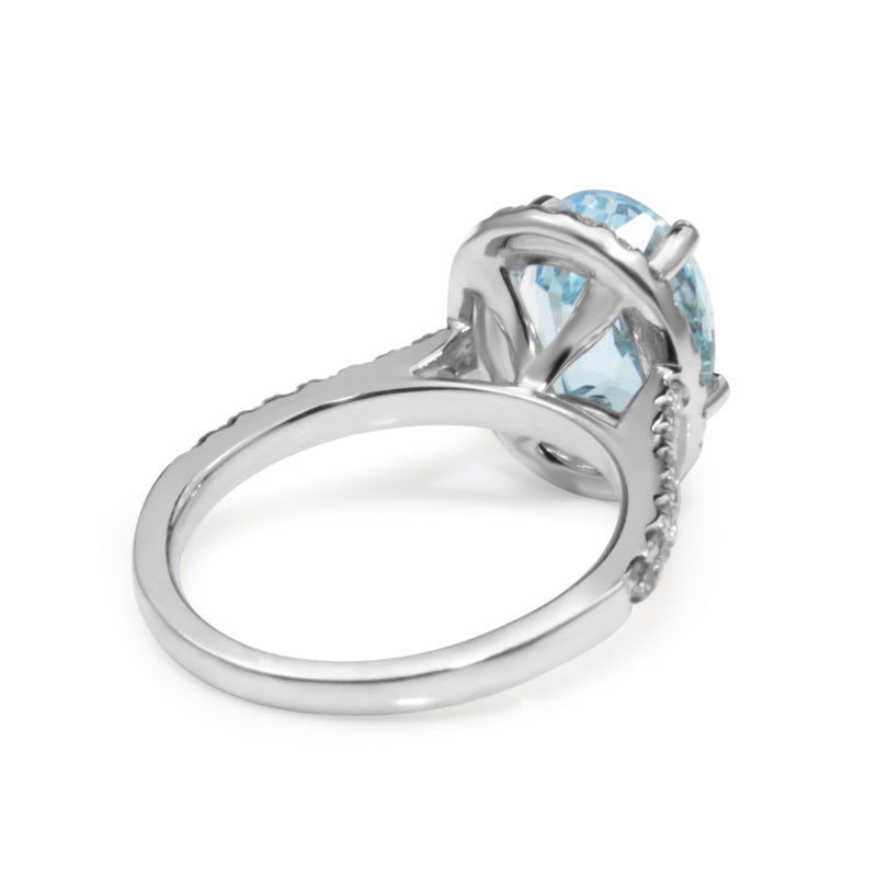 18ct White Gold Topaz and Diamond Halo Ring