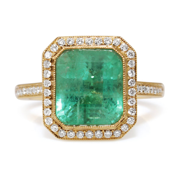 18ct Yellow Gold Emerald and Diamond Halo Ring