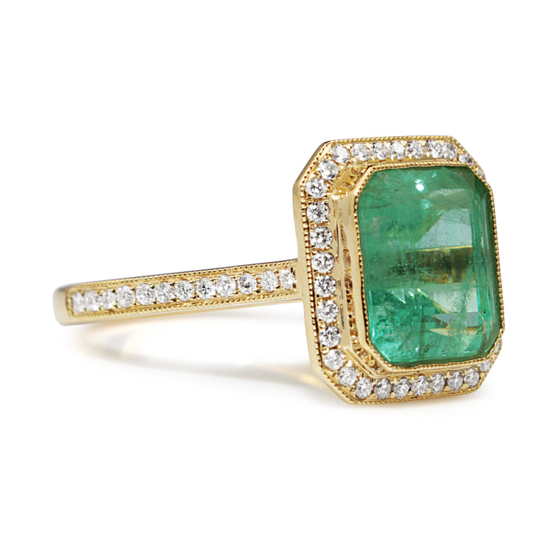 18ct Yellow Gold Emerald and Diamond Halo Ring