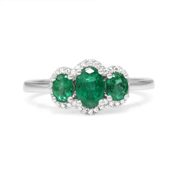 18ct White Gold 3 Stone Emerald and Diamond Halo Ring