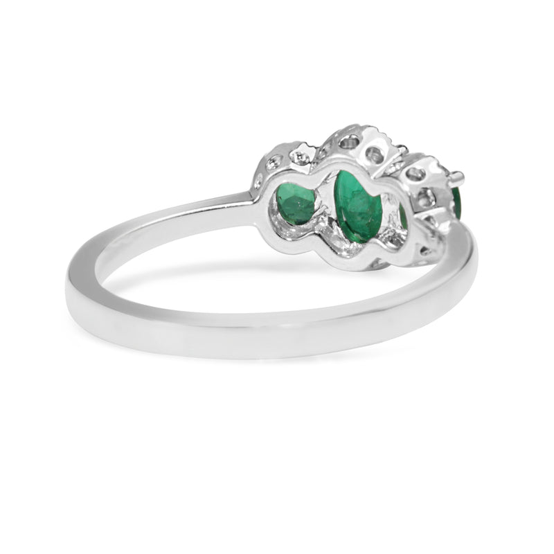 18ct White Gold 3 Stone Emerald and Diamond Halo Ring