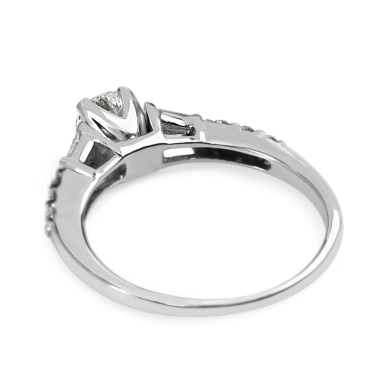 Platinum Diamond Solitaire Ring with Baguette Diamonds