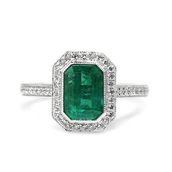 18ct White Gold Emerald and Diamond Halo Ring