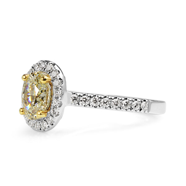 18ct Yellow and White Gold Oval Yellow Diamond Halo Ring