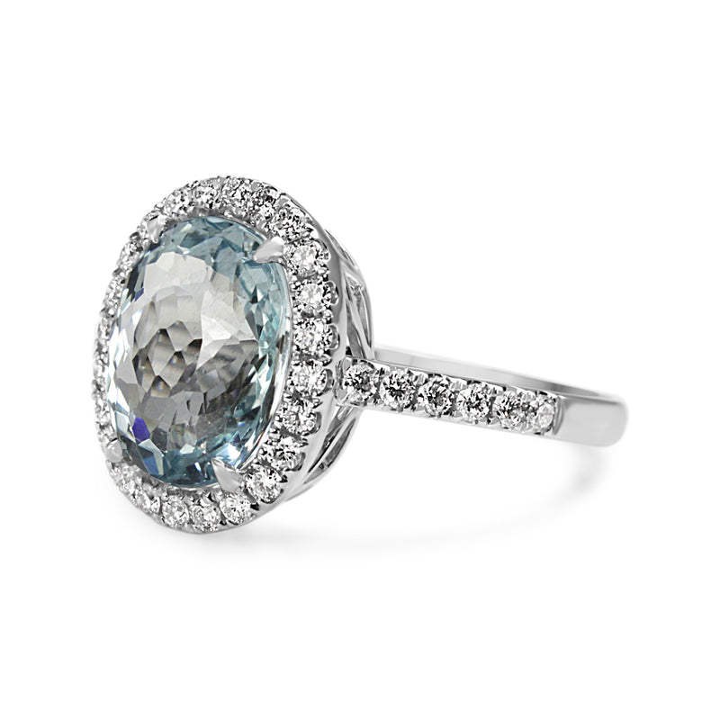 18ct White Gold Oval Aquamarine and Diamond Halo Ring