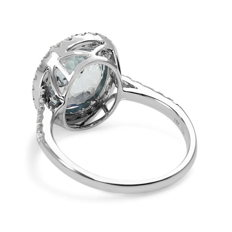 18ct White Gold Oval Aquamarine and Diamond Halo Ring