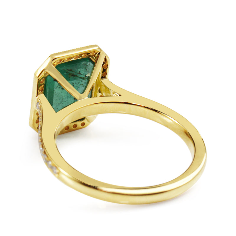 18ct Yellow Gold Emerald Cut Emerald and Diamond Halo Ring