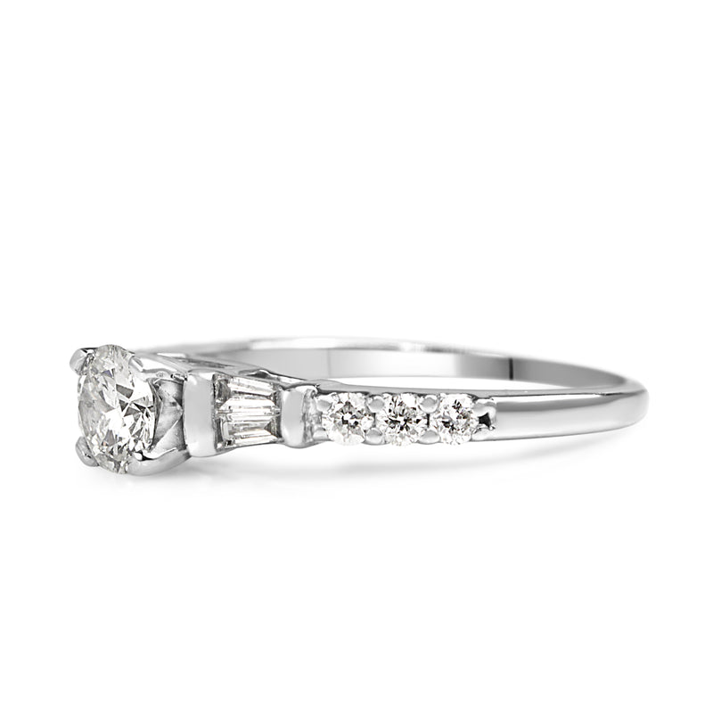 Platinum Diamond Solitaire Ring with Baguette Diamonds