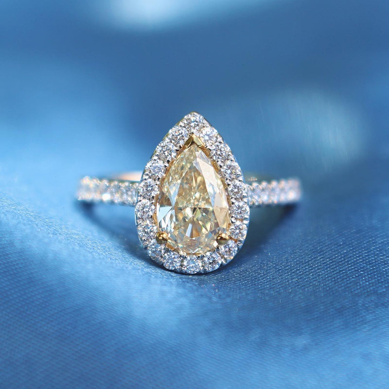 18ct Yellow and White Gold Fancy Yellow Pear Diamond Halo Ring